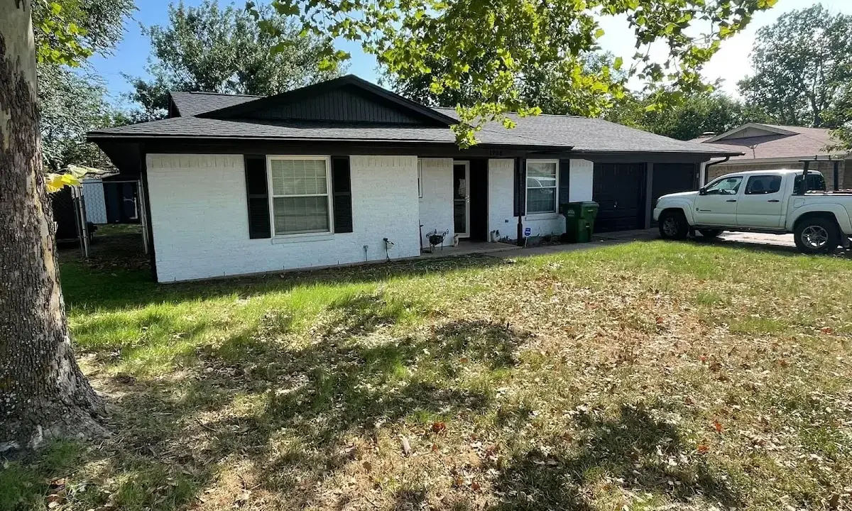 Professional roofing crew working on a residential roof in Mitchellville